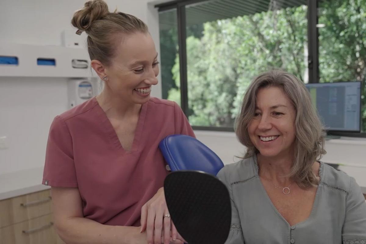 periodontist smiling at patient